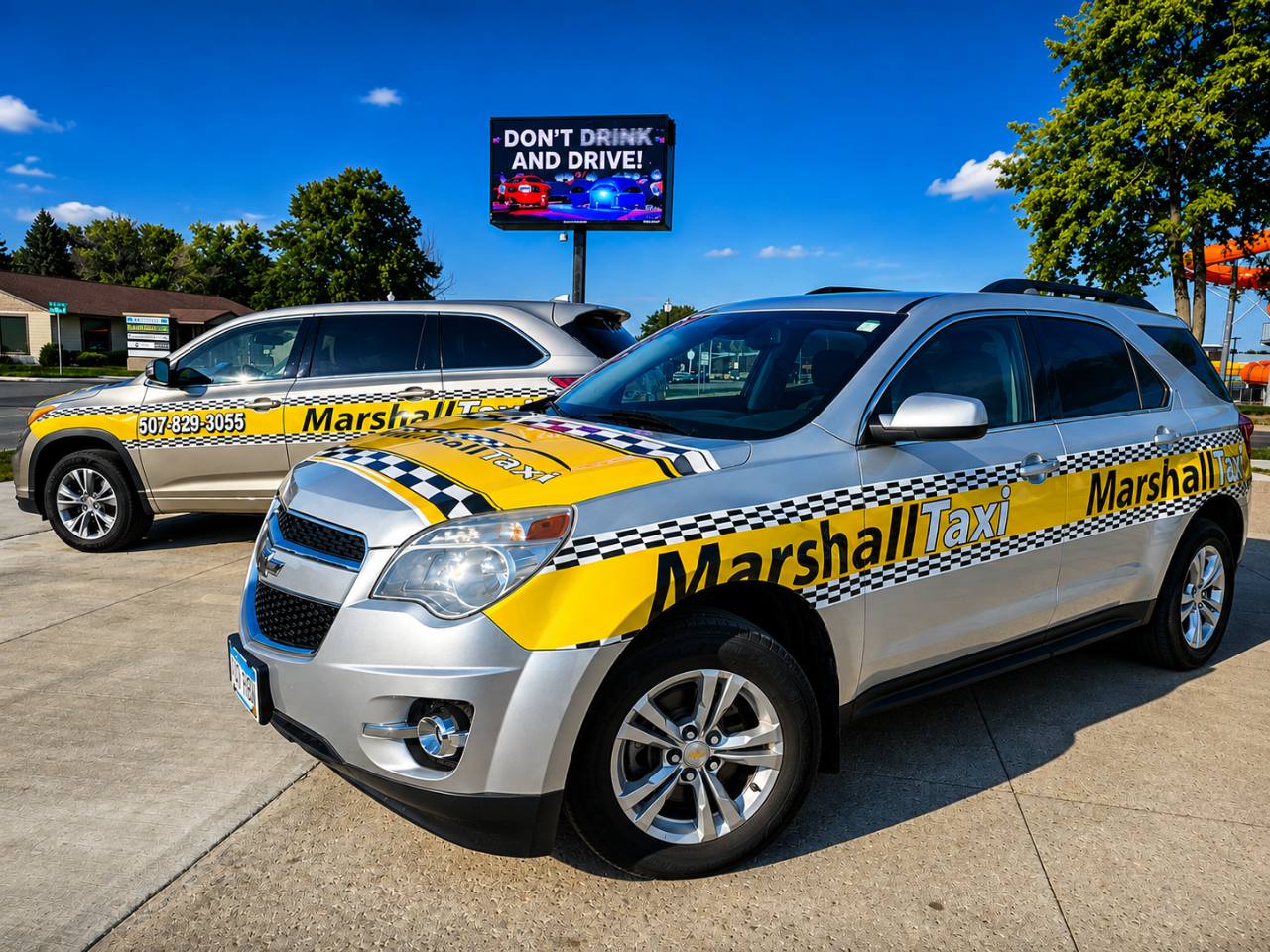 Two Marshall Taxi vehicles parked in Marshall, Minnesota